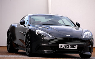 Black sports car white building - a white building free wallpaper