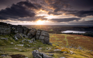 Rocky outcrop lake cloudy sky - a rocky outcropping free wallpaper