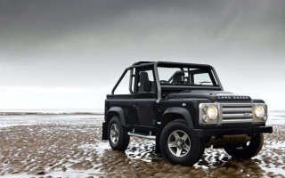 Black land rover beach snow - a dark sky in the background free wallpaper
