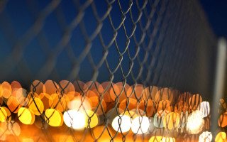 Blurry fence lights autumn leaves - mesh wire free wallpaper