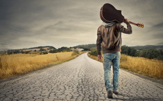 Man walking guitar hat beach - bob singer free wallpaper