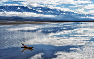 Mountain lake clouds tree ship - a tree branch in the foreground free wallpaper