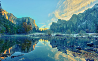 Mountain lake trees rocks clouds - the water below free wallpaper