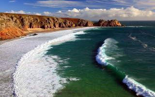 Beach wave cliff sky ocean - a cliff in the background free wallpaper