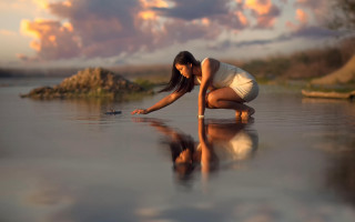 Woman kneeling water cellphone rock - reflection free wallpaper for desktop