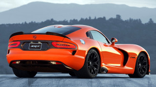 Bright orange sports car mountain 2 - hard surface free wallpaper