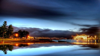 Lake pier building night city - almada negreiro free wallpaper