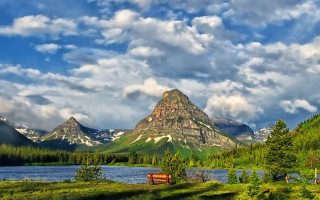Scenic mountain lake bench nature - a scenic view of a mountain range free wallpaper