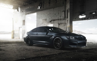 Black car garage brick wall - a black car free wallpaper