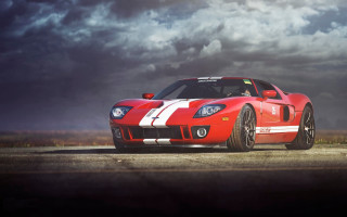 Red sports car cloudy sky 12 - a road under a cloudy sky free wallpaper