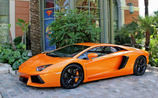 Bright orange sports car building 2 - a blue door free wallpaper