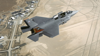 Fighter jet desert town road - over a desert landscape free wallpaper