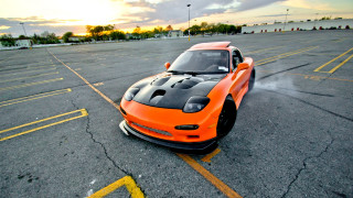 Orange sports car parking lot 11 - yellow line free wallpaper