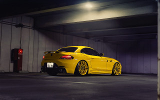 Yellow sports car parking garage 4 - a parking garage free wallpaper