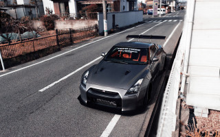 Car street fence building vroom - a fence and a building free wallpaper