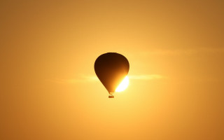Hot air balloon sunset yellow - a yellow sky free wallpaper