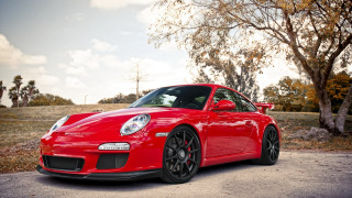 Red sports car autumn leaves 2 - redshift free wallpaper