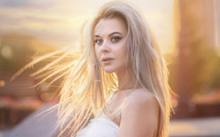 Blonde woman building sky portrait - a sky background and a building in the background free wallpaper