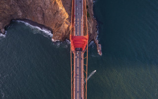Red truck bridge ocean cliff - a red truck free wallpaper
