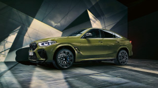 Green bmw suv dark room - a spotlight free wallpaper