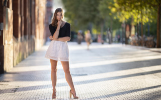 Woman backlighting city cosplay blurry - a sidewalk free wallpaper