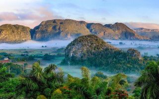 Mountain valley forest mist sky - a mountain range free wallpaper