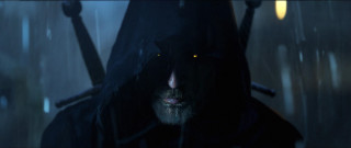 Hooded man glowing eyes rain - sinister free wallpaper