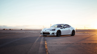 White sports car runway sunset - cinematic focus free wallpaper