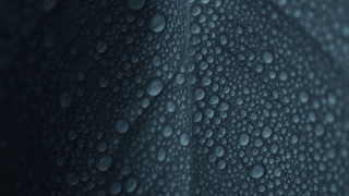 Water droplets blurry dark background - a cloth free wallpaper