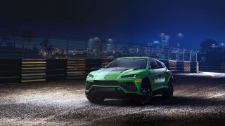 Green sports car night cityscape - a green sports car free wallpaper
