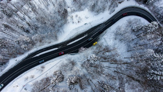 Snowy forest road yellow car - the road free wallpaper
