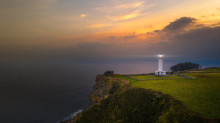 Lighthouse cliff ocean sunset cityscape 2 - a light house free wallpaper
