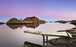 Dock lake rocks purple sky - pastel color palette free wallpaper