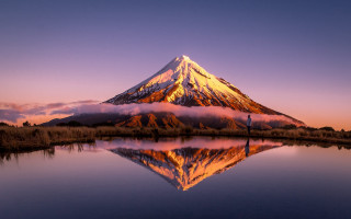 Mountain reflection sunset clouds ocean - a reflection free wallpaper