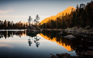 Lake trees rocks mountain dusk - the shore free wallpaper