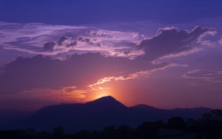 Sunset mountain clouds cityscape beach - a few building free wallpaper for desktop