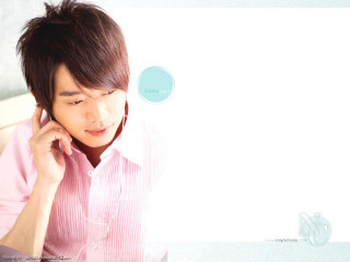 Man talking cellphone sitting laptop - a laptop computer free wallpaper for desktop