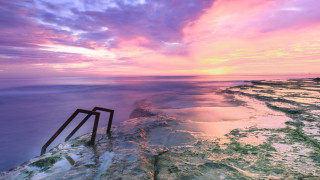Rocky cliff sunset puzzle saturated - a rocky cliff free wallpaper