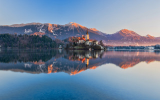 Small island church lake mountains - a church free wallpaper