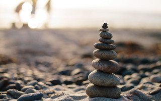 Stack rocks beach bike tire - a stack of rocks free wallpaper