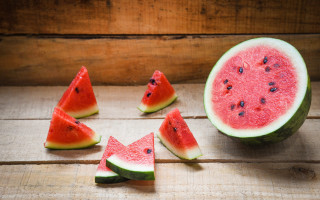 Watermelon halves fruit wooden table - half free wallpaper