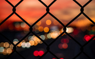 Blurry city night fence chainlink - andor basch free wallpaper
