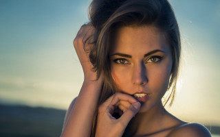 Woman white shirt bun hands - piercing eye free wallpaper