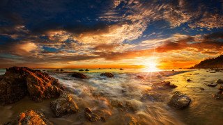 Sunset rocky beach dusk ocean - a sunset over a rocky beach free wallpaper