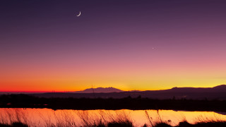 Sunset moon distant mountains lake - a moon free wallpaper