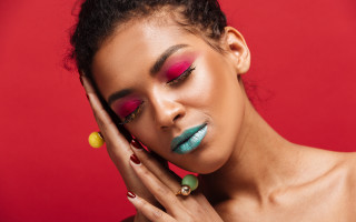 Bright makeup red background portrait - free aesthetic wallpaper