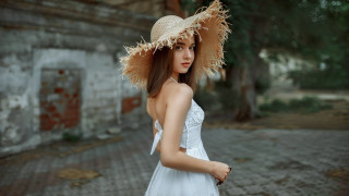 Woman white dress straw hat 2 - a brick road in front free wallpaper