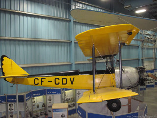 Yellow airplane hangar display man - front view free wallpaper