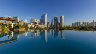 City skyline reflection tiltshift panorama - a clear blue sky free wallpaper