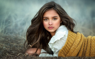 Woman blowing hair sweater scarf - free portrait wallpaper